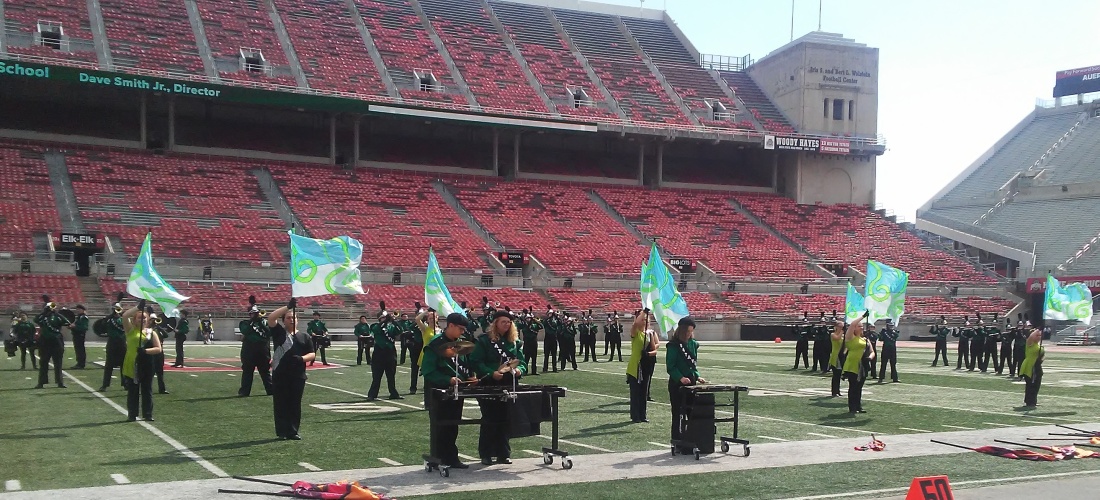 Marching band and colorguard performing in Ohio Stadium at the Buckeye Invitational
