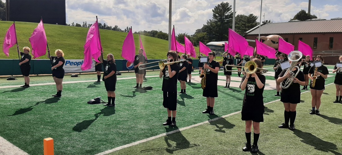 Colorguard and marching band performing during OU Band Day Guard